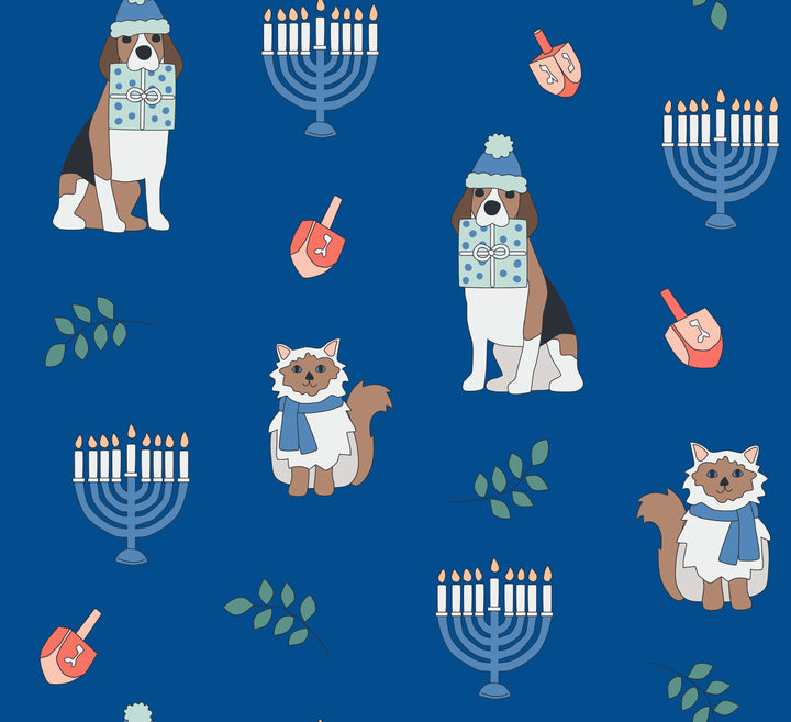 Blue fabric crib sheet featuring a pattern of dogs, cats, menorahs, and dreidels.