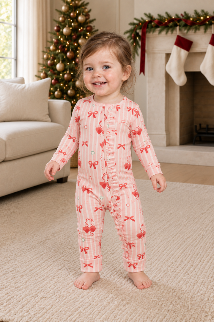 Toddler wearing Peppermint Lane pink striped ruffle convertible zip footies, full outfit view.